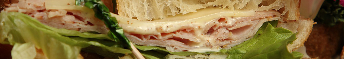 Eating Italian Pizza Sandwich at Umberto's of Long Island restaurant in Dunedin, FL.
